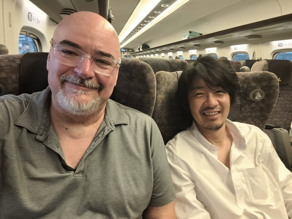 Don Walker and Shin-Ichi Konno riding Japan's Shinkansen.